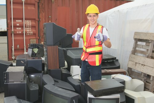 House clearance team removing furniture from a home in Peckham
